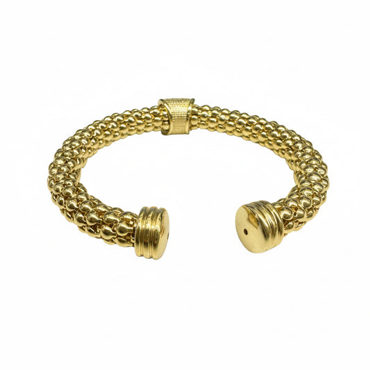 Gold cuff bracelet with textured beaded design and flat round ends. Sizes available: S, M, L.