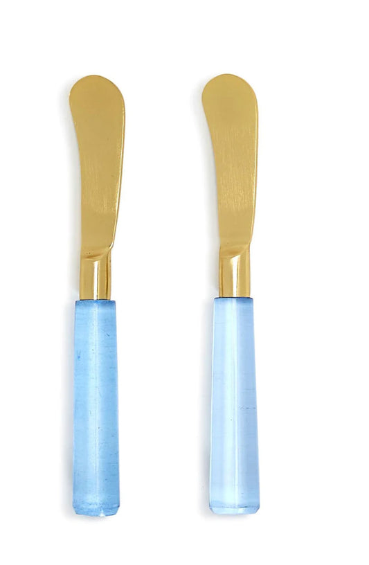 Two Blue Skies Spreaders with gold blades and glossy light blue handles. Available sizes: 5", 6", and 7".
