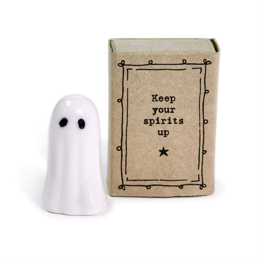 Small white ghost figurine with black eyes. Sizes available: not specified. Brown box reads "Keep your spirits up.