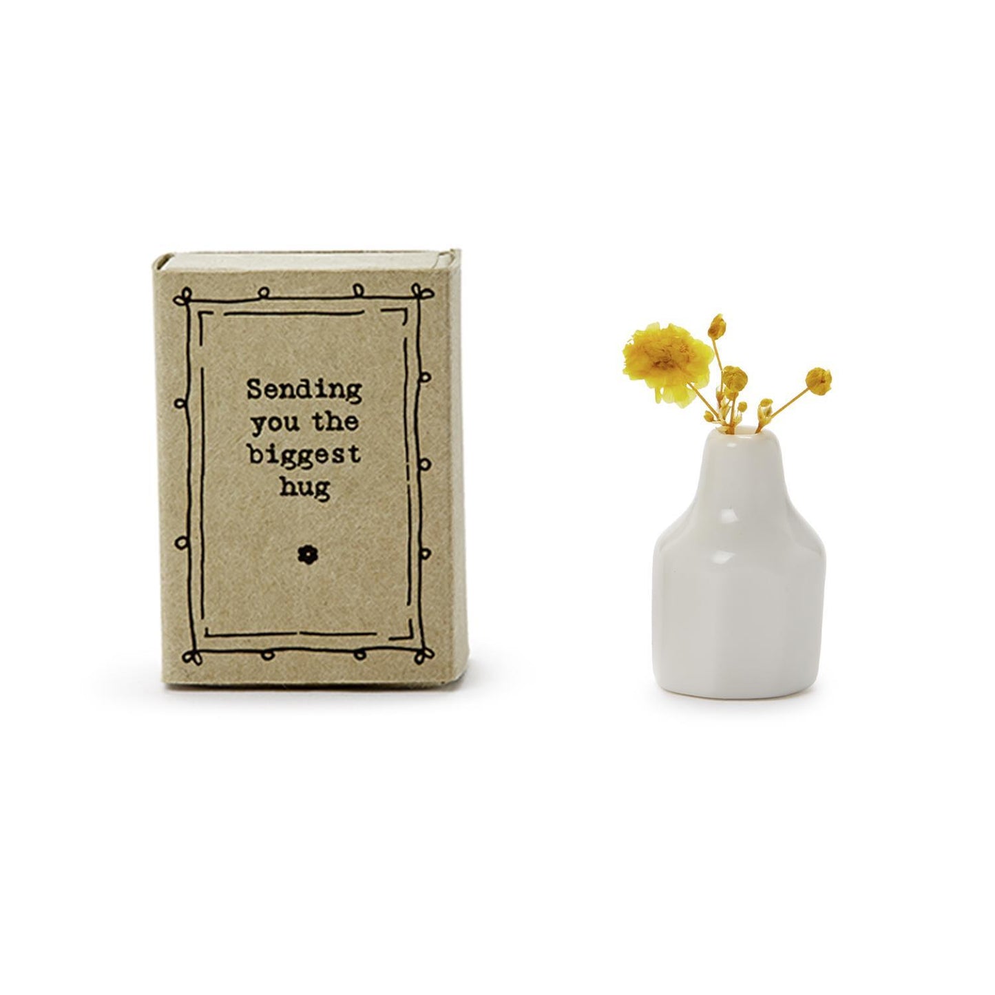 The "Lovely Matchbox Vase with Flowers" is a small brown box featuring the message "Sending you the biggest hug," containing a Matchbox vase filled with vibrant yellow dried flowers. Available in one standard size.