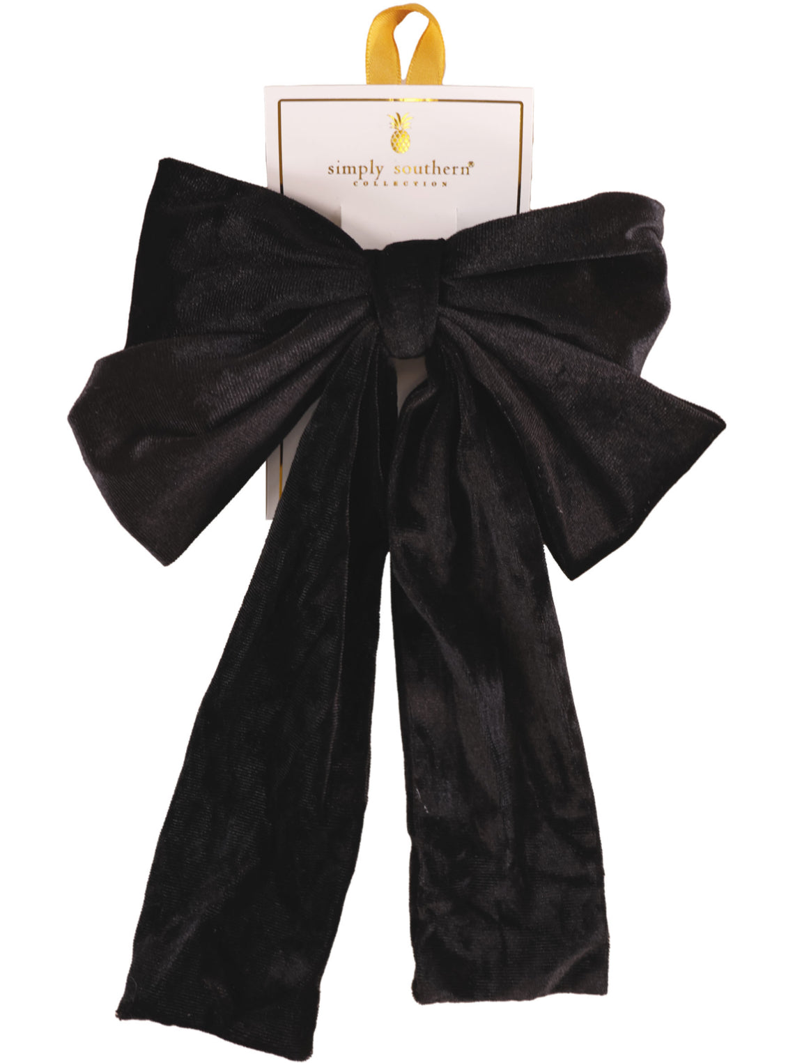 Large black velvet bow hair accessory with long tails; available in one size.