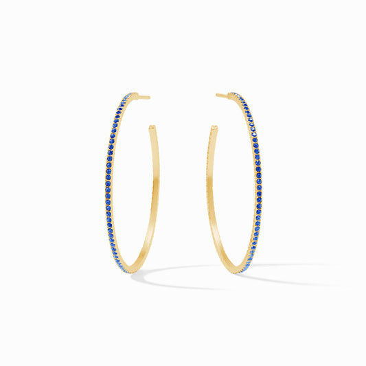 Large, thin 18K gold-plated hoops with blue pavé CZ gemstones along the outer edge. Available in large size.