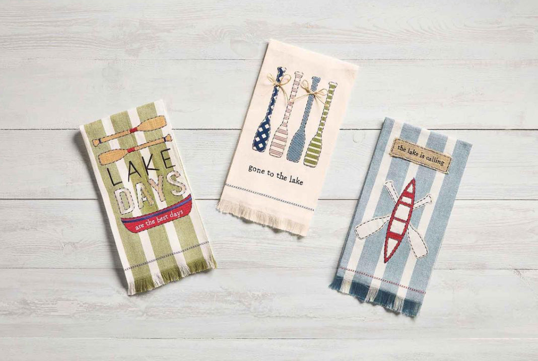 Three Lake Applique Towels, cotton weave, oar/canoe graphics, raw-edge fringe, lake phrases. Available in 16"x28".