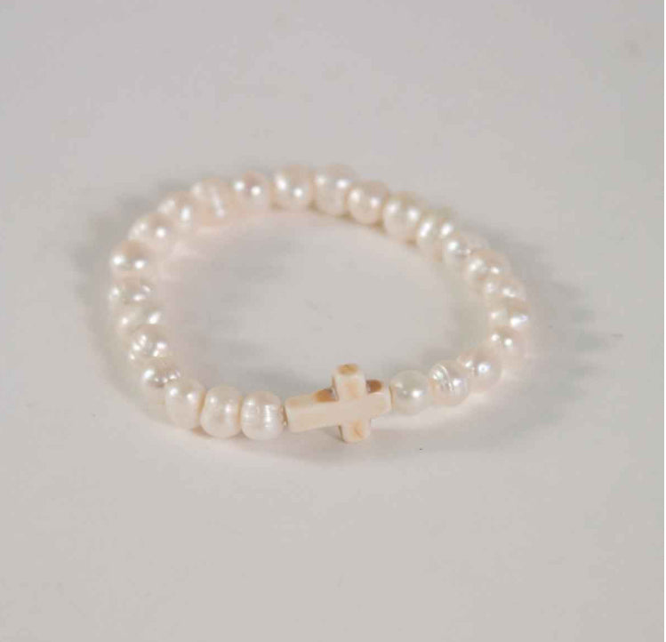 The Maria Cross Pearl Bracelet White: small white pearls, single cream stone cross bead. Available sizes: S, M, L.