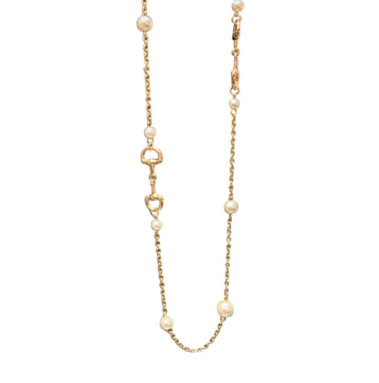 Candy Gold Pearl Necklace with small pearls, gold heart-shaped links, and horse-bit details along the chain. Available in 16" and 18" lengths.