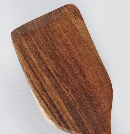 Close-up of wooden spatula with rounded edges and visible grain; available in 10-inch and 12-inch sizes.