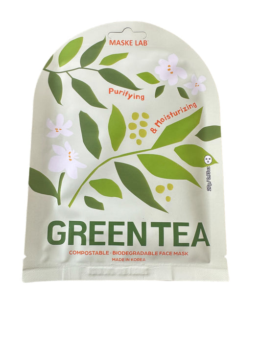 **Product Description:**
- **Product Name:** Maske Face Mask
- **Design:** Green tea leaves, white flowers
- **Text:** "Purifying & Moisturizing"
- **Origin:** Made in Korea
- **Sizes Available:** One-size-fits-all