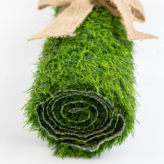 Artificial green grass table runner with burlap ribbon, size 12x47 inches.