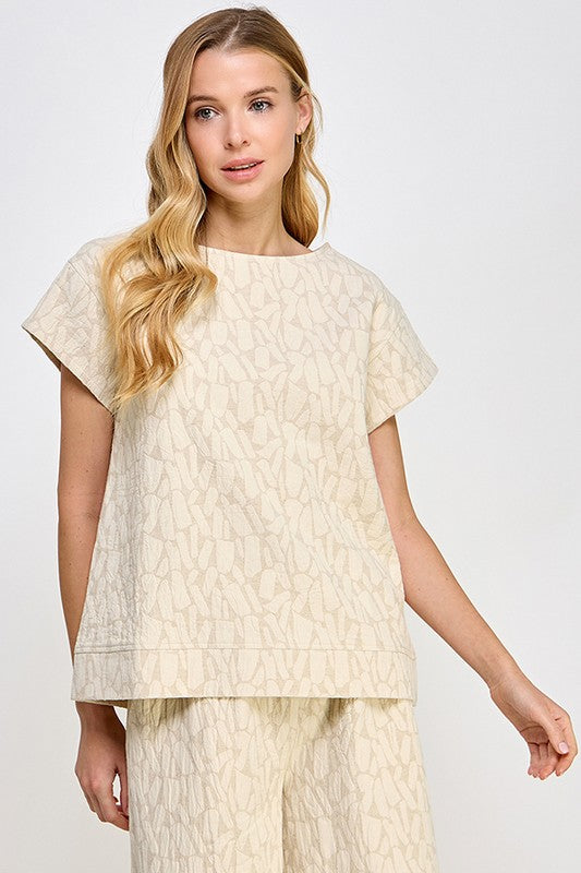 Beige Jacquard Linen Lounge Set: short-sleeved, loose-fit top and wide-leg pants with subtle pattern. Sizes: XS–XL.