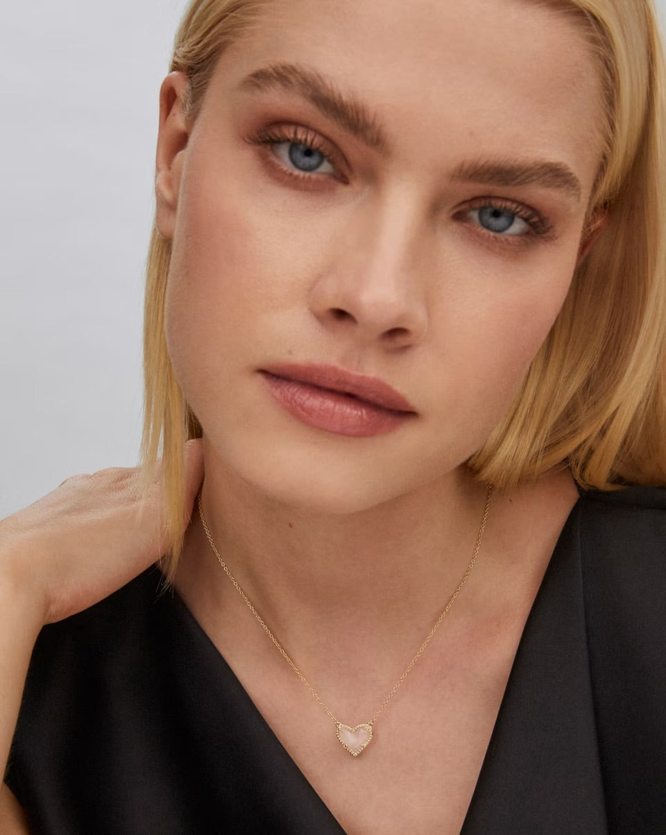 Ari Heart Gold Pendant Necklace by Kendra Scott, gold chain with heart-shaped pendant; available in 15"-17" sizes.