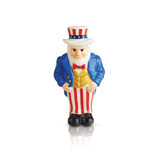 Nora Fleming Minis Uncle Sam ceramic figurine: blue jacket, striped pants, star hat. Available in one mini size.