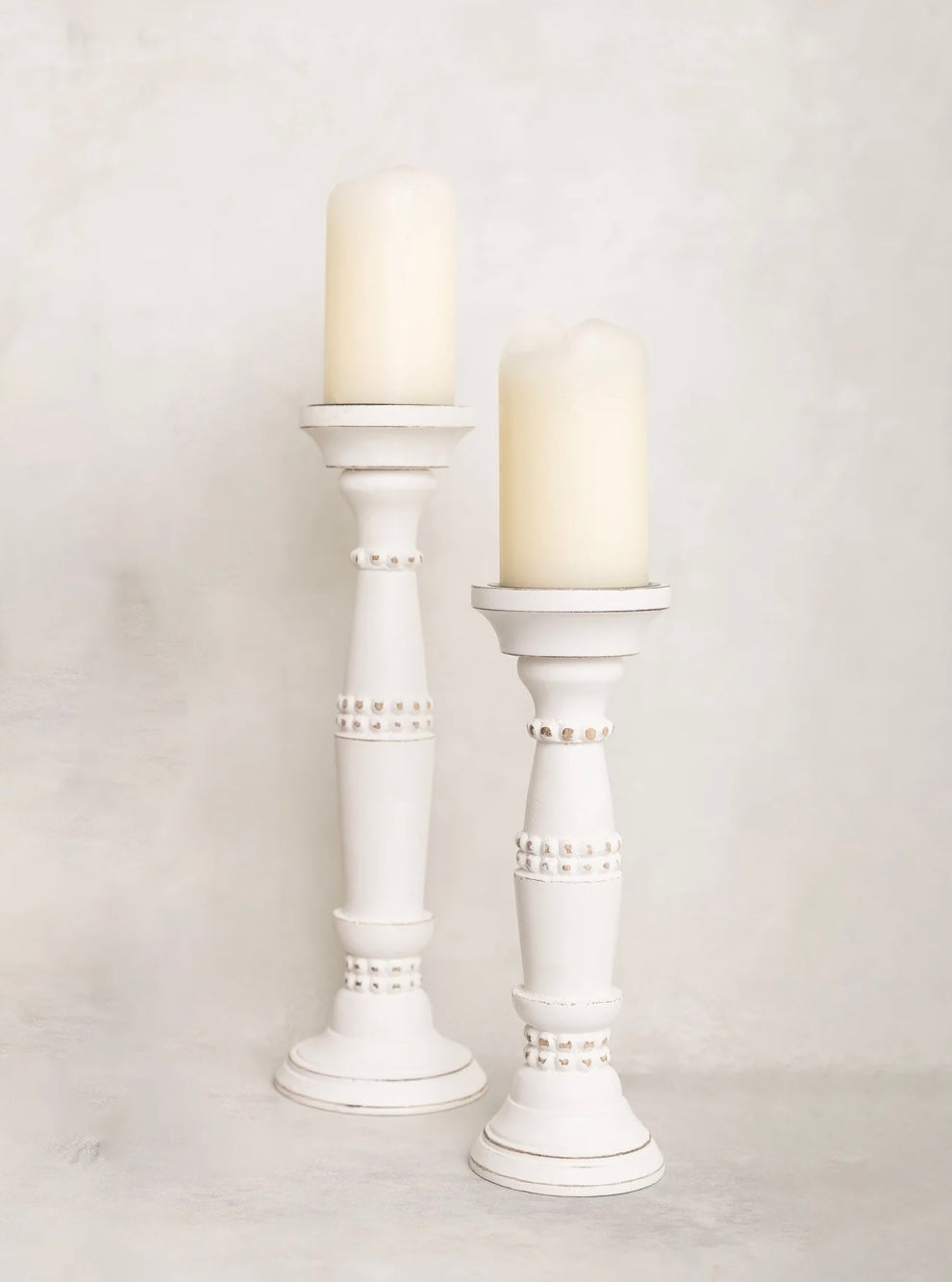 Beaded Candle Stick holders with ornate design and beaded accents, available in 10" and 14" sizes.
