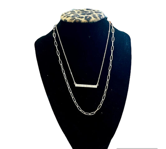 Gold Necklace with Studded Cross Bar Accent: layered gold chains, pavé-studded bar, elongated links. Available in S/M/L.