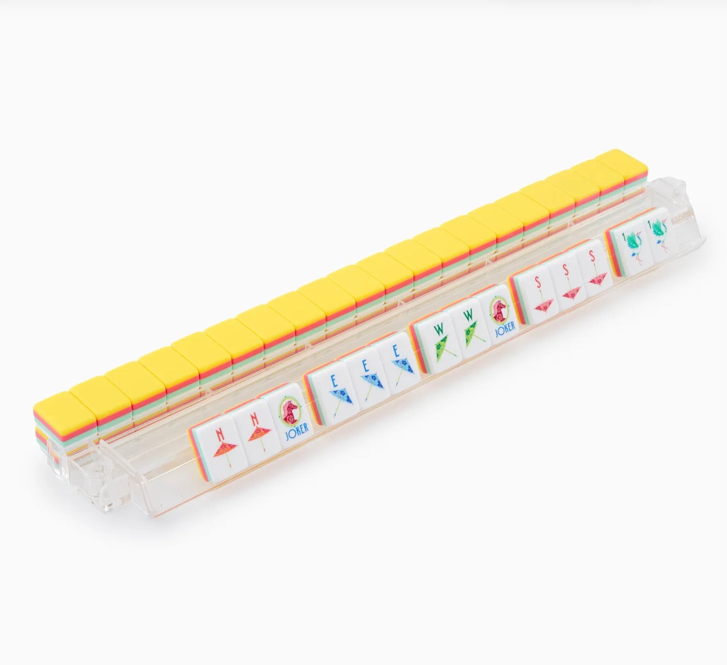 Clear tile rack with yellow Pippa Mahjong Tiles, some face up showing wind and dragon characters. Available in multiple sizes.