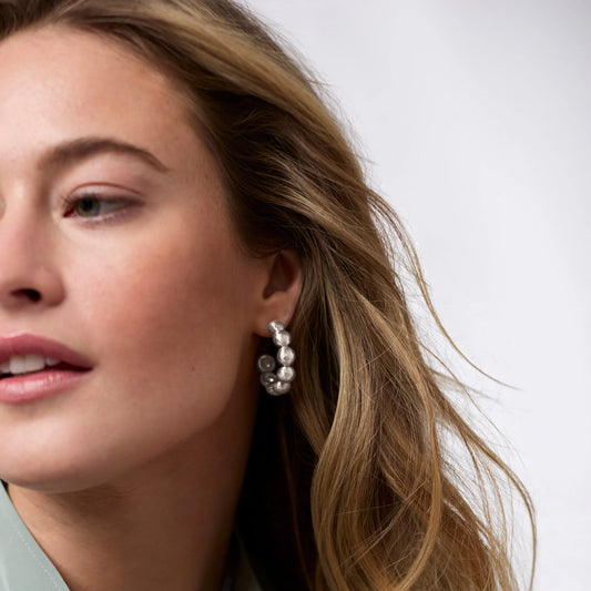 Solara Nova Hoop Silver earrings, available in small, medium, and large sizes.