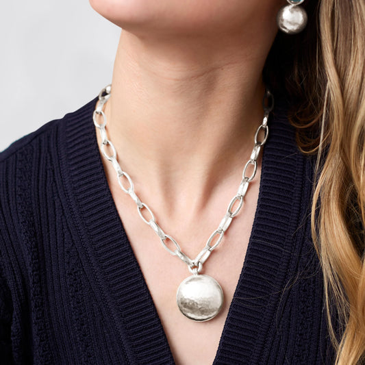 Solara Necklace Silver: chunky silver chain with large starburst medallion pendant. Available in 16", 18", and 20" lengths.