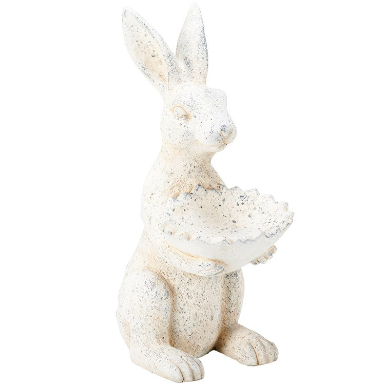 White, speckled stoneware rabbit figurine holding a scalloped bowl. Available sizes: 8" and 12".
