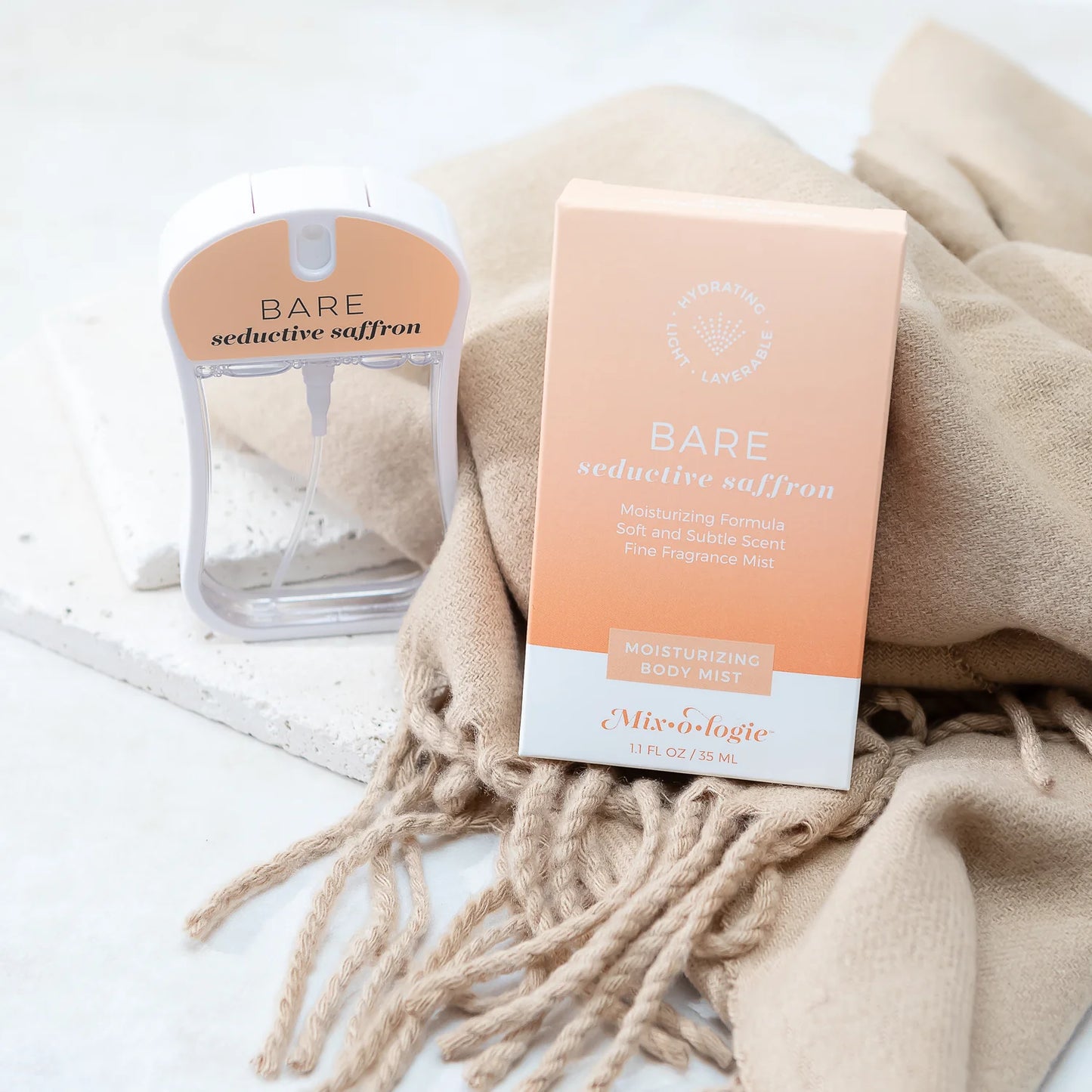 Bare Seductive Saffron Moisturizing Body Mist | Mix O Logie in peach and white packaging; available in 1.7oz and 4oz sizes.