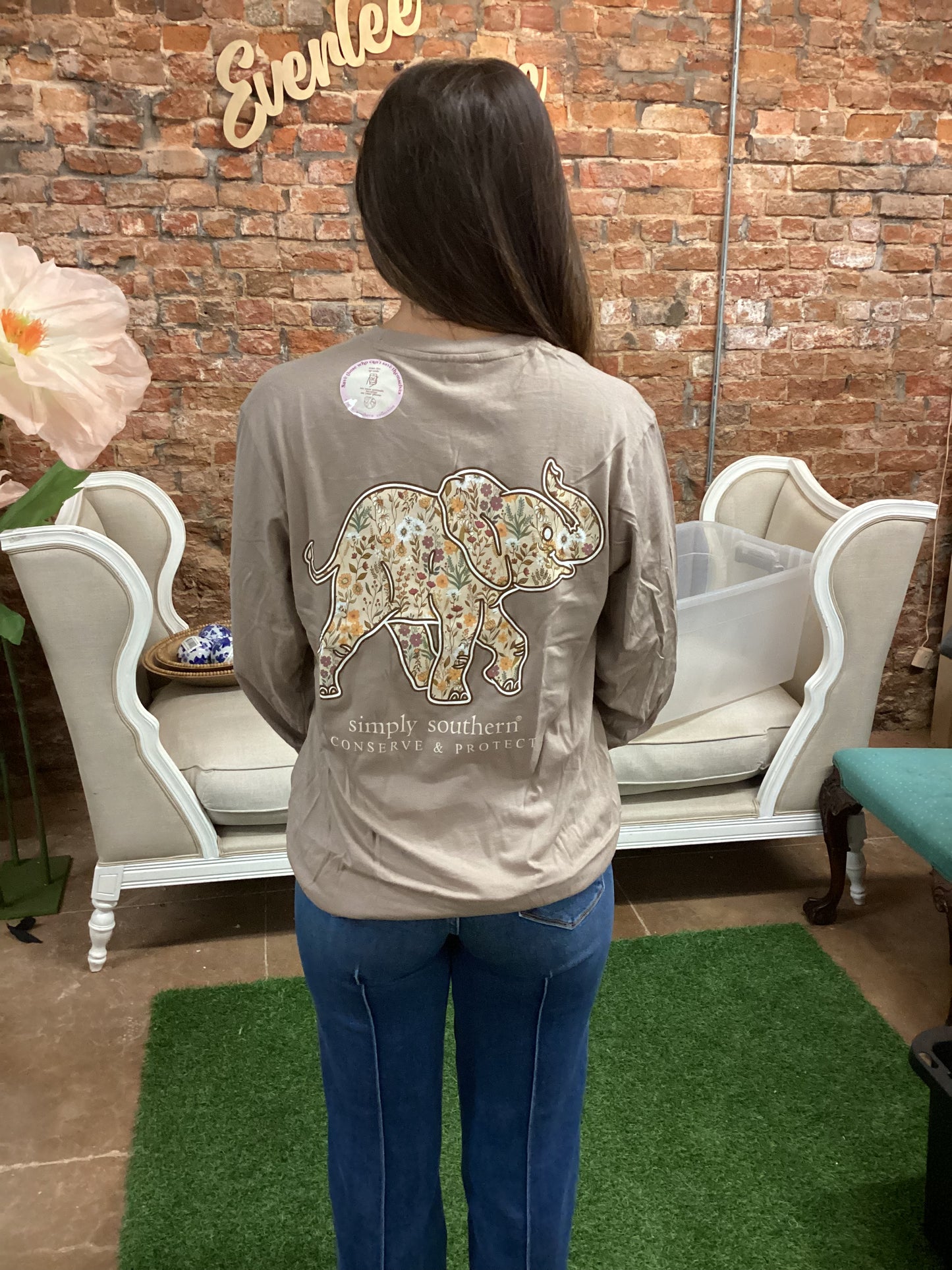 Wildflower Elephant Long Sleeve T-Shirt in mocha with floral elephant print, "Simply Southern Conserve & Protect" text. Sizes S-XXL.