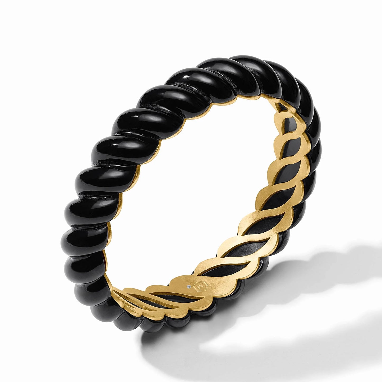 Ravello Statement Bangle Obsidian Black with a twisted resin design in gold and glossy obsidian black, featuring a 24K gold-plated inner band. Available sizes: Small, Medium, Large.
