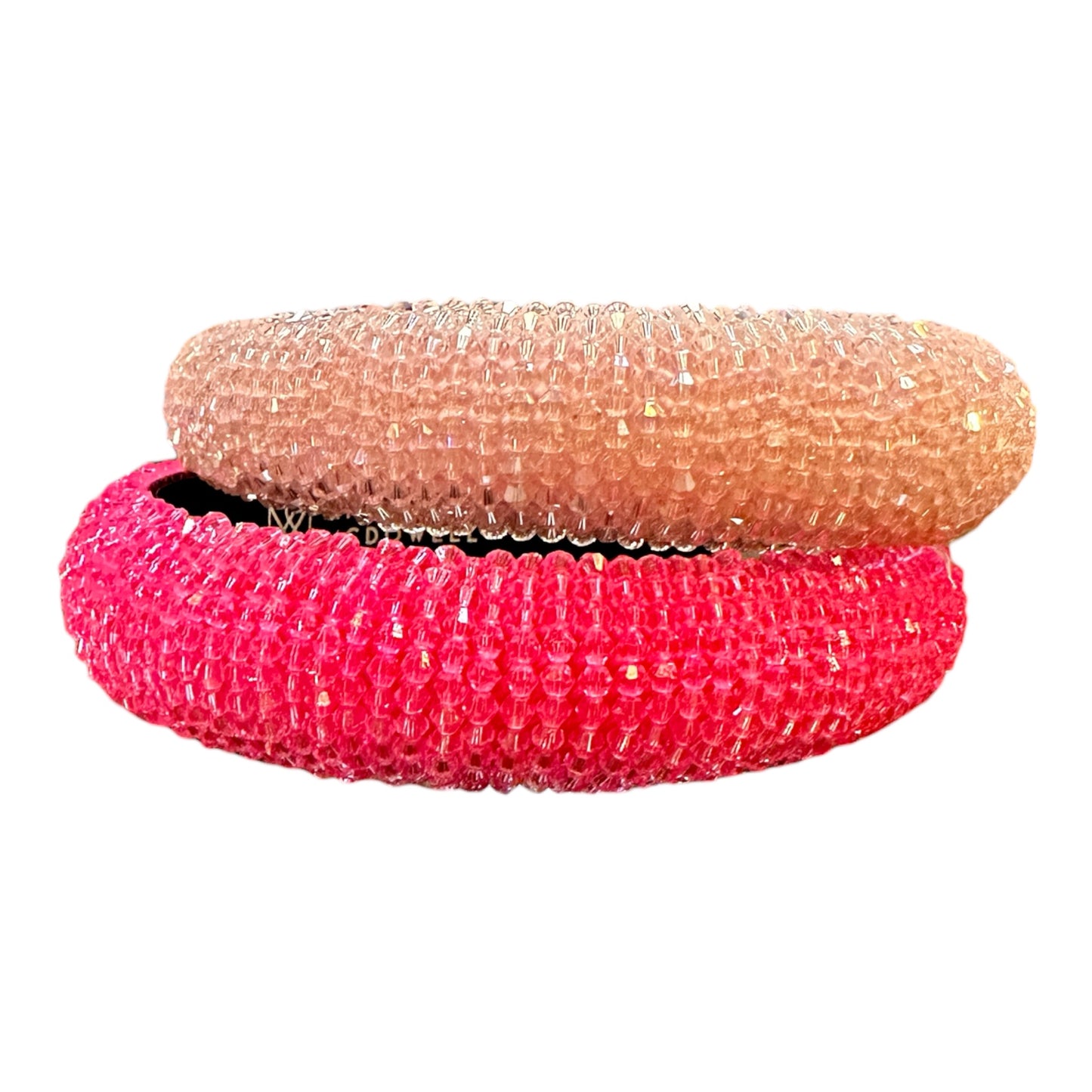 Two stacked headbands in light and vibrant pink with glittery, beaded texture. Available in S, M, L sizes.