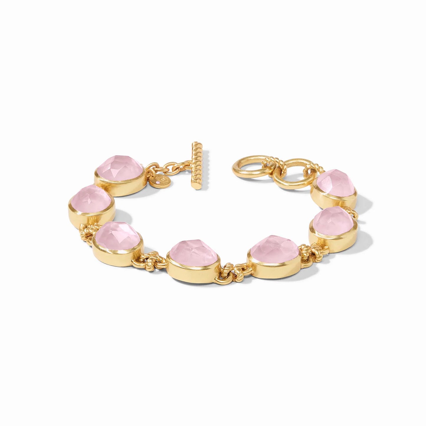24K gold plate chain bracelet with round faceted pink stones, gold bezels, toggle clasp. Available sizes: S, M, L.