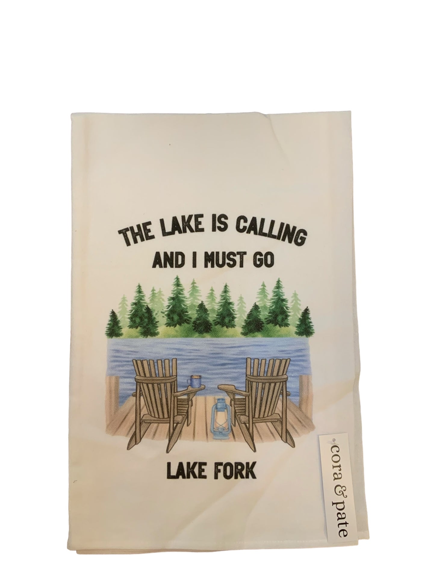 Tea towel. The lake is Colleen and I must go. It has two chairs overlooking the lake with pine trees in the background and it says Lake Fork