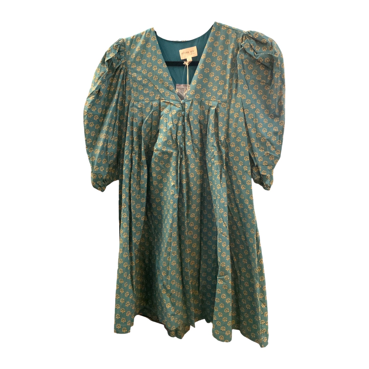 Teal knee-length dress with yellow floral print, puffed 3/4 sleeves, V-neck with gathered front. Sizes: XS–XL.