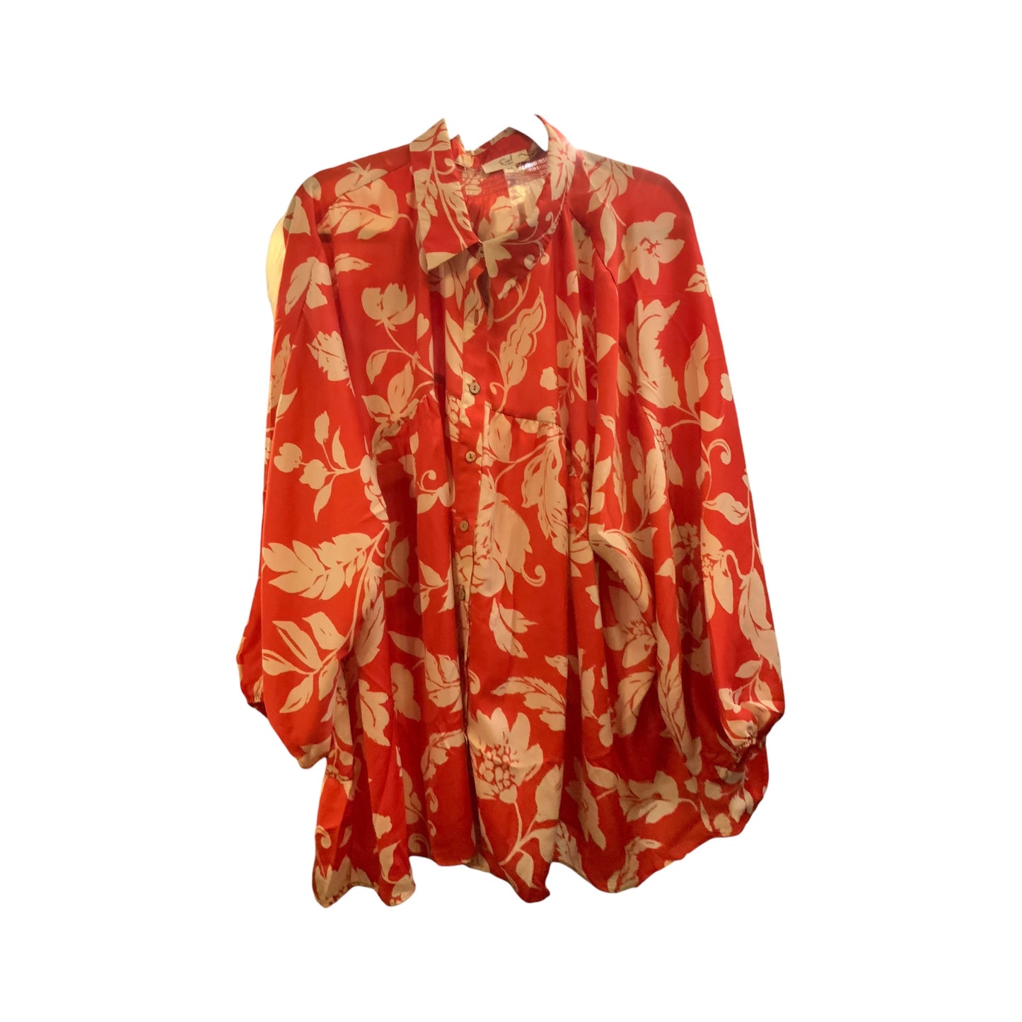 Rust Bubble Sleeve Printed Mirabelle Blouse with loose fit, long sleeves, button-down front, collar, cream floral print. Sizes S-XL.