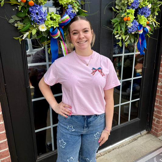 USA Cherry Bow SS T-Shirt for girls with small American flag bow. Available in sizes XS-XL. Perfect for Fourth of July.