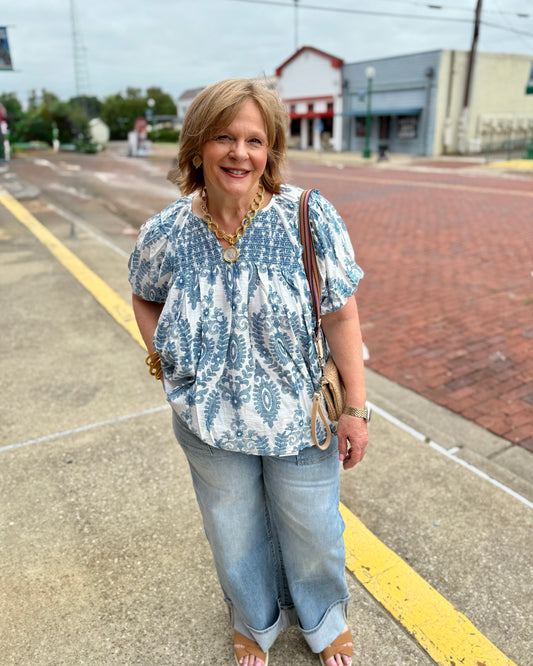 Blue and white Short Sleeve Smocking Top, available in sizes XS-XL.