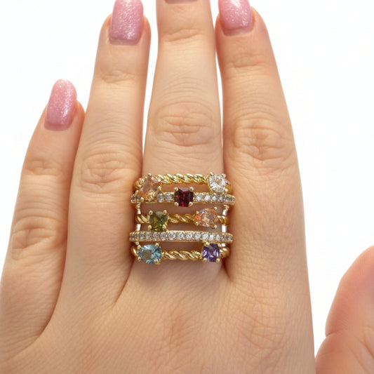 The Ring Edit: three stackable gold bands with colorful gemstones and diamonds. Available in sizes 5–9.