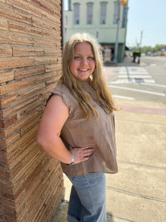 Striped Ruffle Top, available in sizes XS–XL. Simple design with ruffled details and stripe pattern.