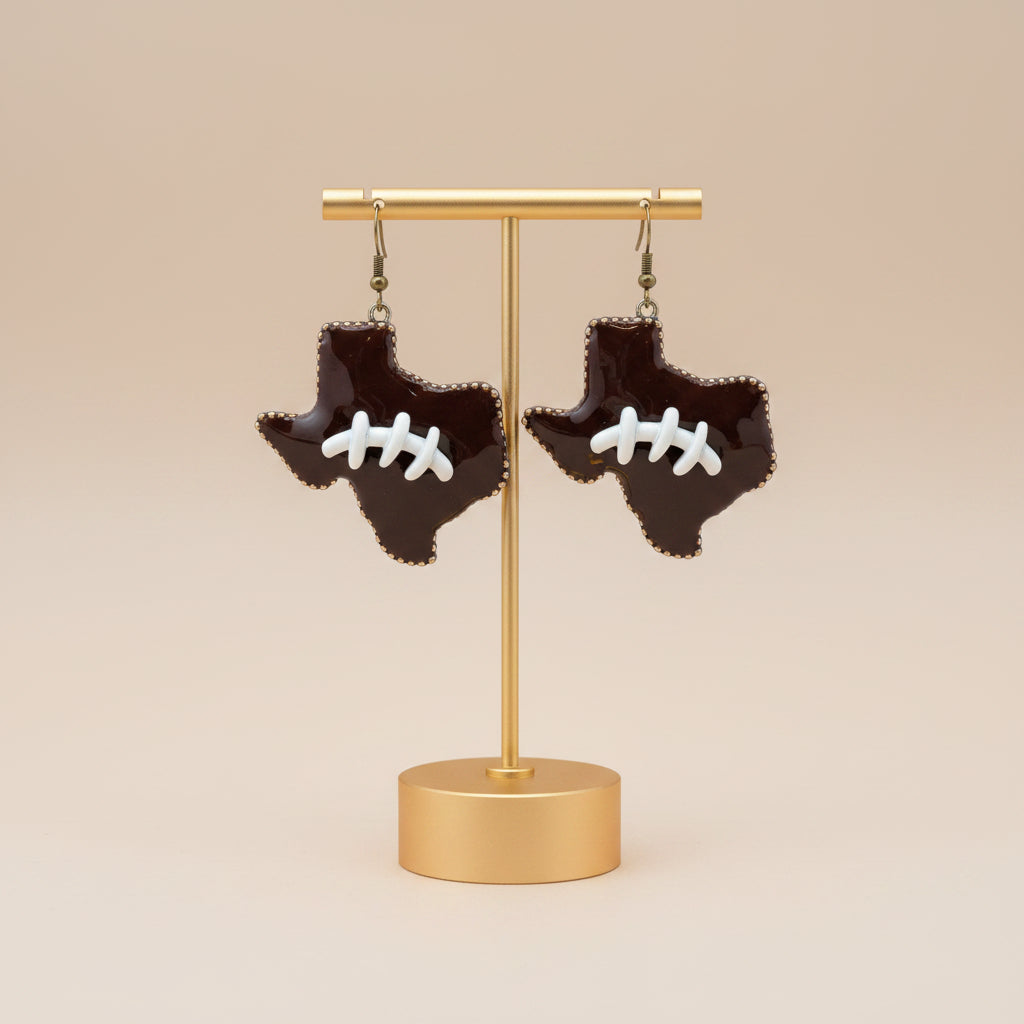 Texas Shaped Football Earrings with brown design and white football laces. Available sizes: small, medium, large.
