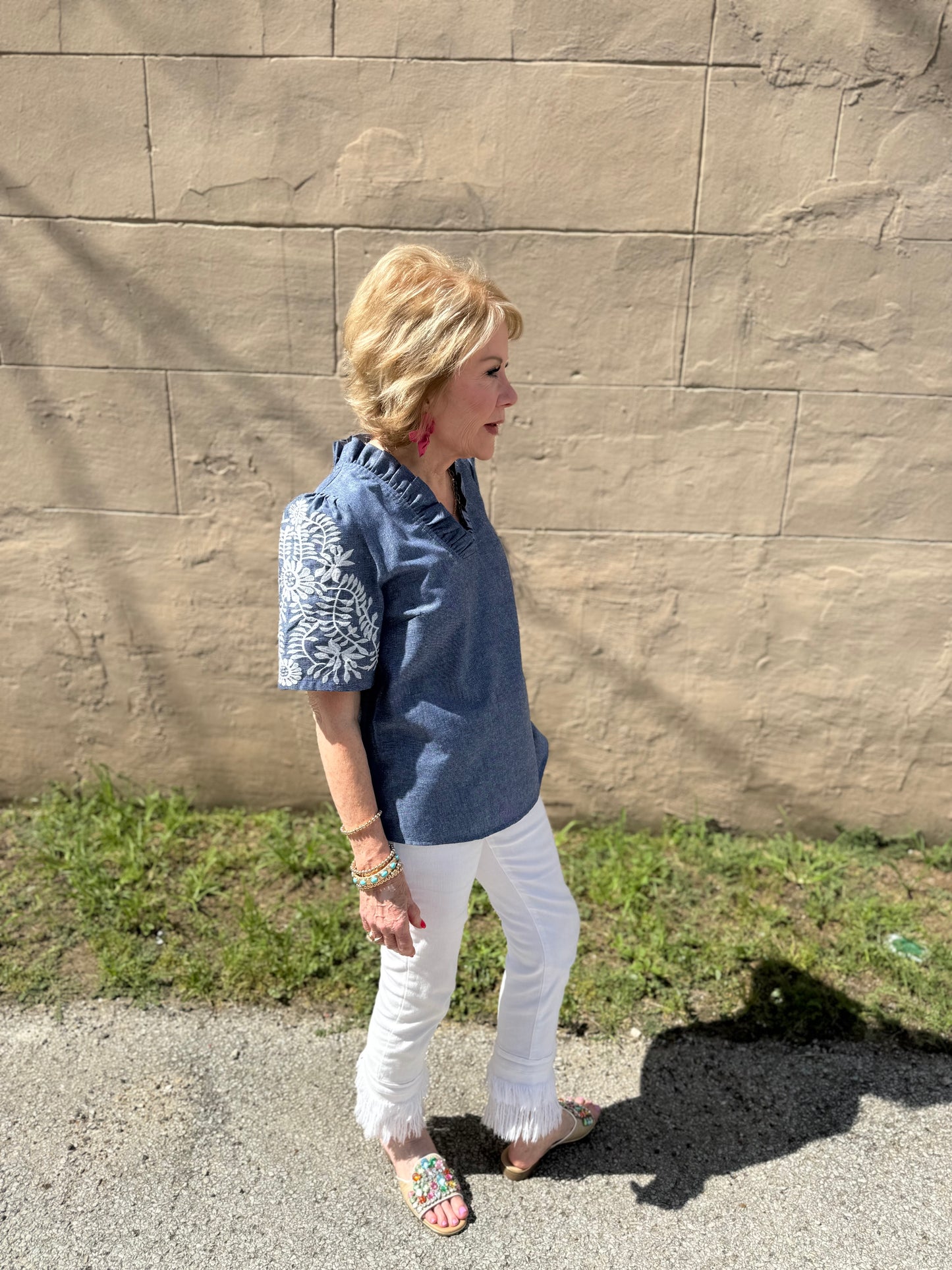 Denim Floral Top available in sizes XS-XL. Features floral print on denim fabric.