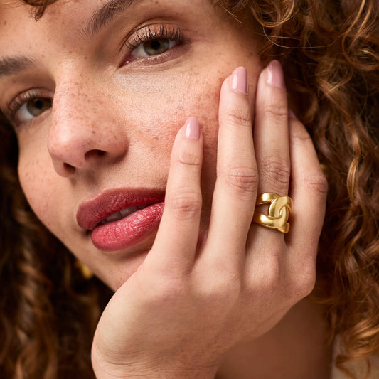 Chunky 24K gold-plated Infinity Ring with looped chain design. Available in sizes 6, 7, and 8.