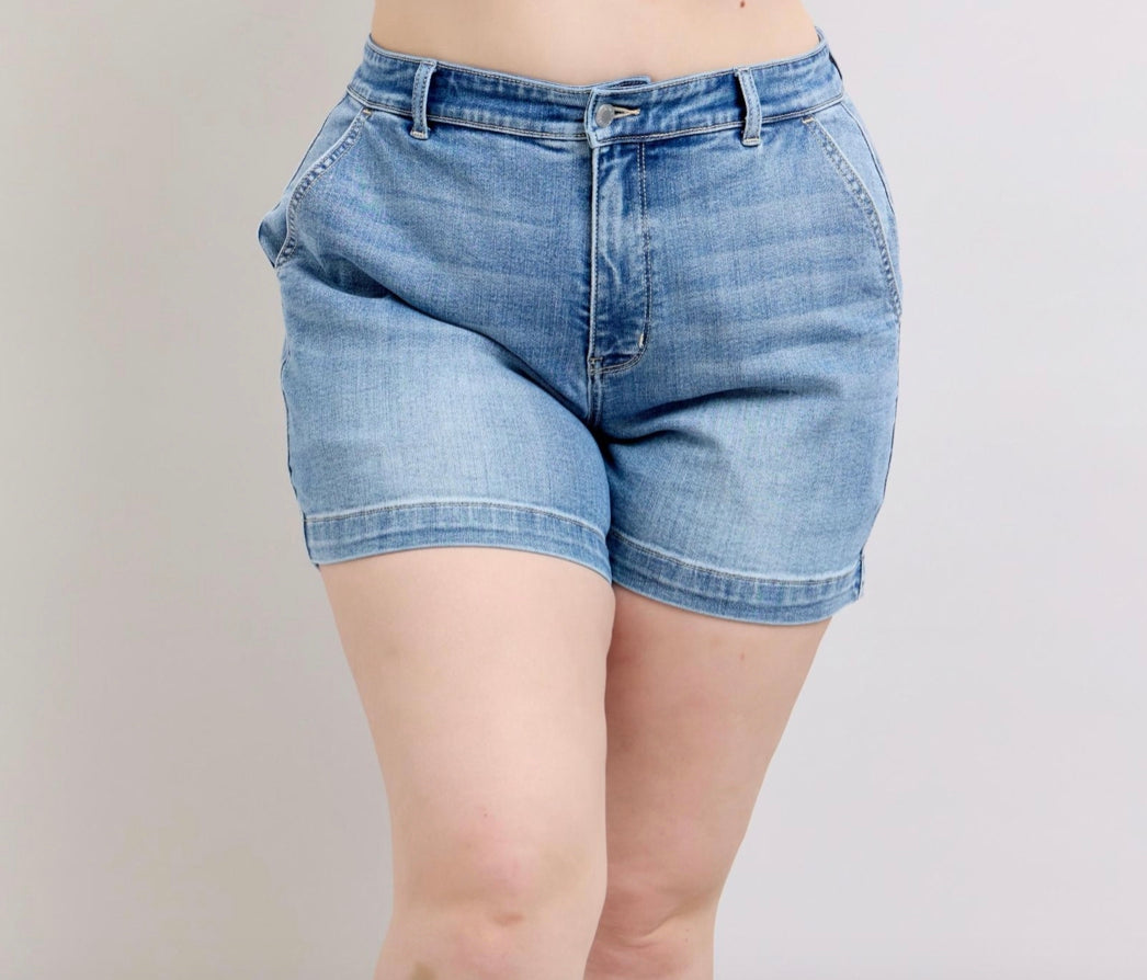 Judy Blue Mid Rise Trouser Shorts: Classic denim shorts perfect for casual summer wear. Available sizes: Small, Medium, Large, X-Large.