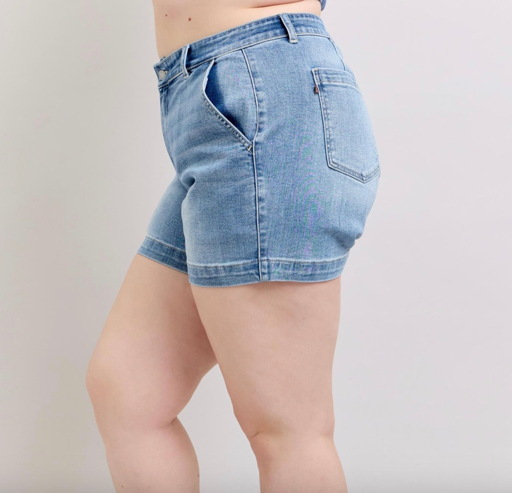 Judy Blue Mid Rise Trouser Shorts in light blue feature front and back pockets. Available in sizes XS to XL.