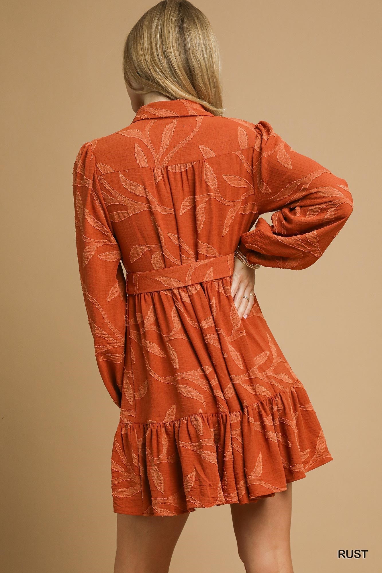 Piper Jacquard Dress with Tie Waist, rust color, long sleeves, leaf pattern. Available in sizes XS-XL.