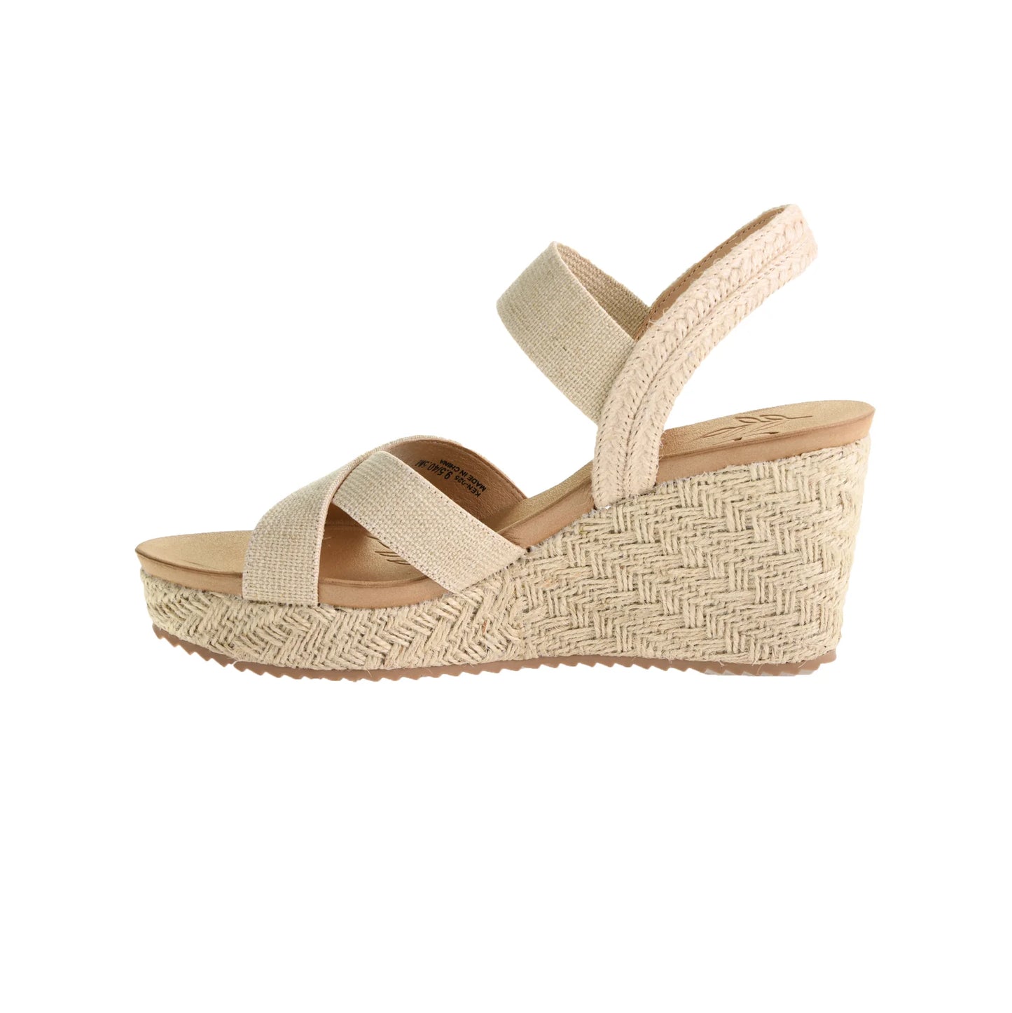 The Key Word Espadrille Wedge Sandal - Natural features a beige color, woven straw heel, zigzag pattern, crisscross straps, ankle strap, stretch gore for comfort, medium heel height for elegance, and a textured outsole for grip. Sizes available: 5-11.