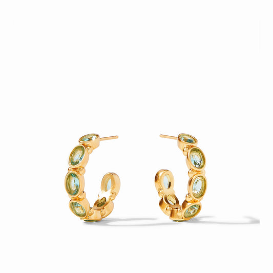 The Mykonos Hoop Earrings- Medium are gilded hoops with sparkling oval green gemstones. Available in medium size.