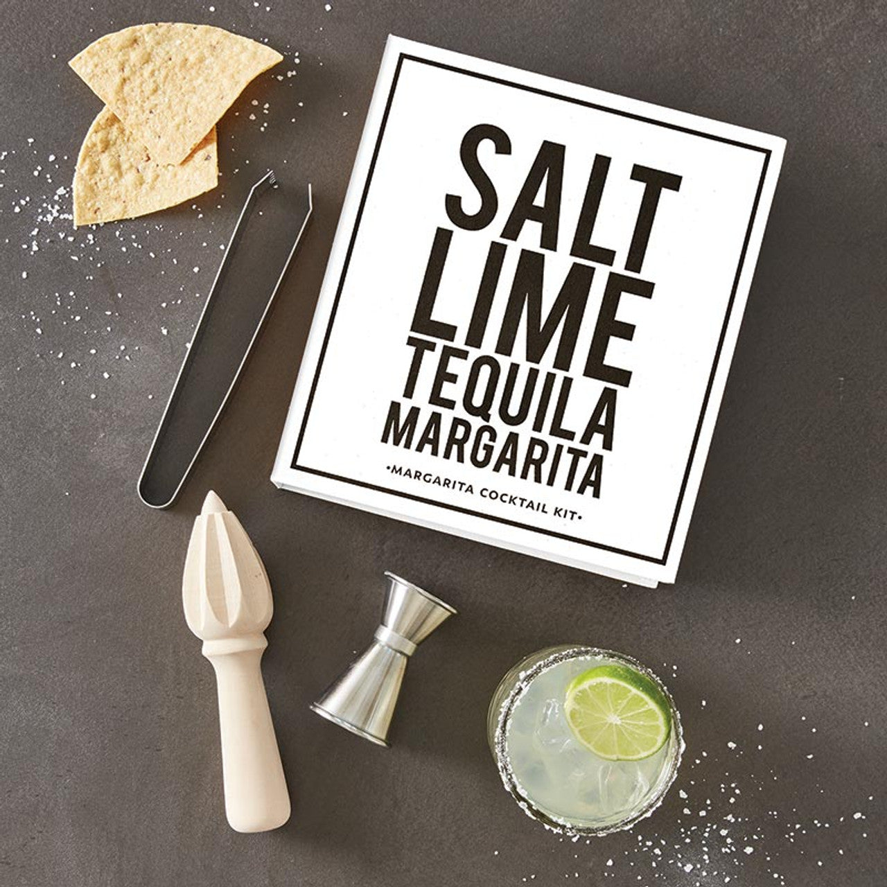 Margarita Book Box - Salt Lime Tequila Margarita: Gift box with margarita glass, lime slices, stainless steel jigger and tongs, citrus juicer, tortilla chips, and salt. Available in one size.
