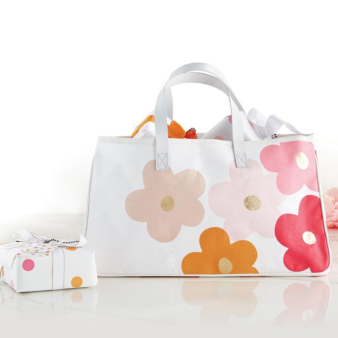 The Canvas Tote - Flowers: White canvas with colorful pink, orange, and peach floral prints. Available in one size.