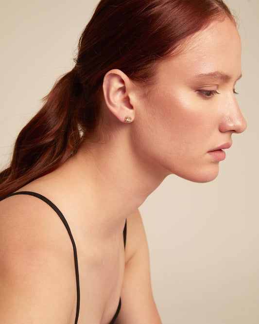 Small handmade stud earrings with white cubic zirconia, available in multiple sizes.