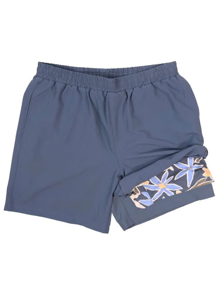 Men’s lawn tropical shorts lined with flowers, pattern waistband cinched a denim blue.  it comes in sizes small medium large extra large and 2X.