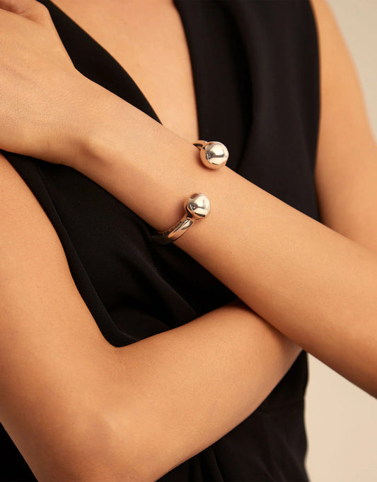 Handmade Bangle Bracelet with Double Ball in sterling silver, featuring round ends and an interchangeable charm; available in sizes S, M, and L.