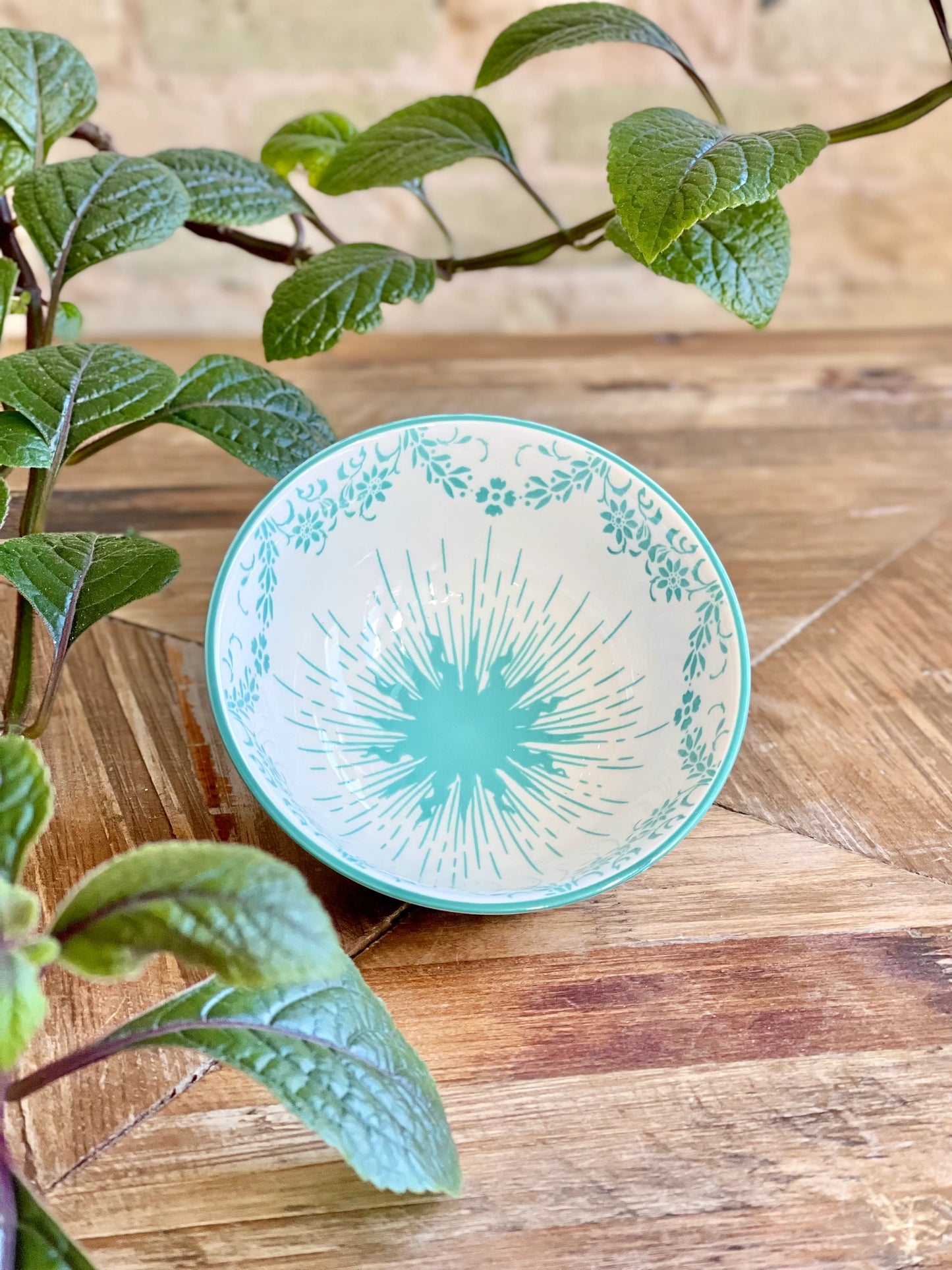 Classic Collection Tidbit Bowl with teal sunburst and floral rim. Available in 4", 6", and 8" sizes.