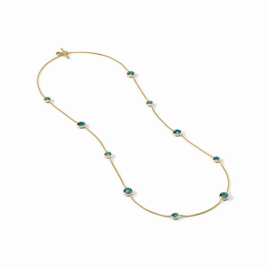Gold chain necklace with evenly spaced round Montana blue gemstones in bezel settings. Available in 16", 18", and 20" sizes.