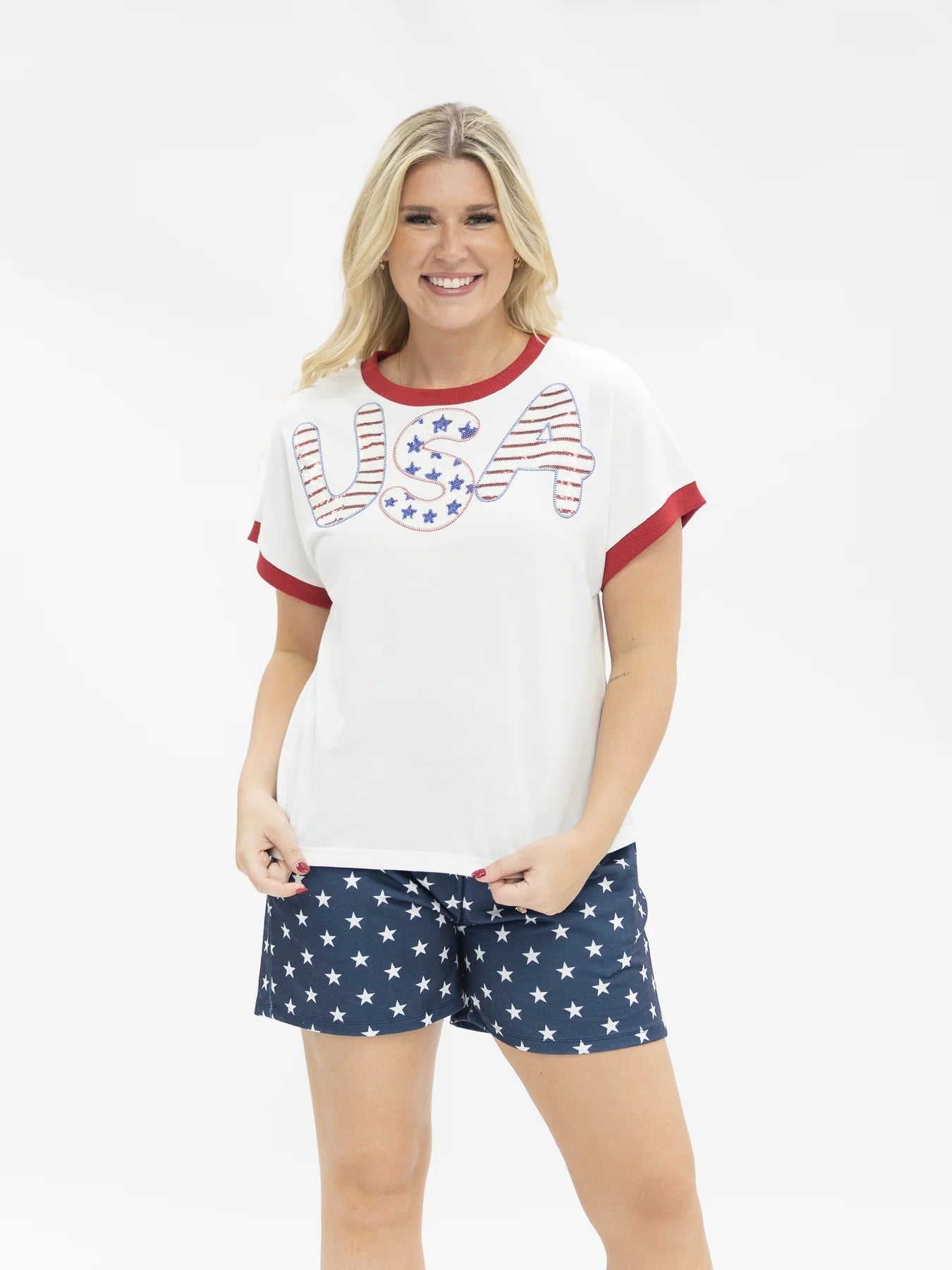 Sequin "USA" White Top with stars and stripes details. Available in sizes S-XL.