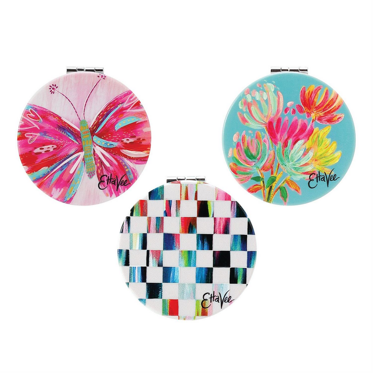 Magnifying Compact Mirror available in three designs: colorful butterfly, vibrant flowers, and geometric grid pattern. Features "EttaVee" by Jessi Raulet. Sizes: 2 inches (diameter).
